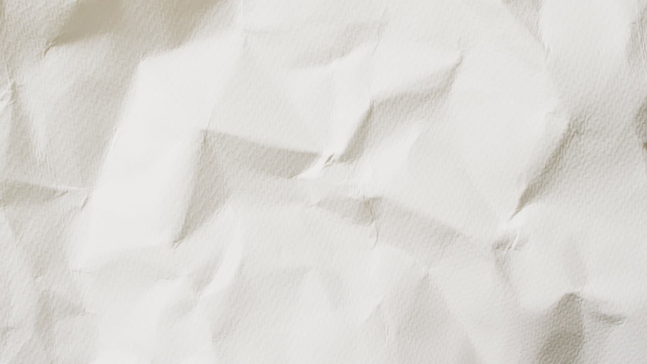 Video of close up of crumpled white paper texture background