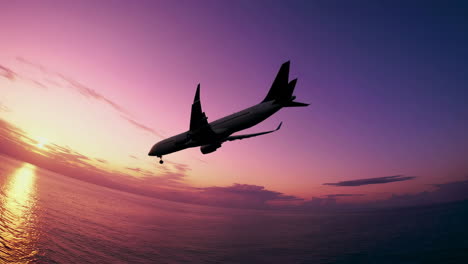 airplane flying over ocean at sunset