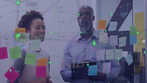 Animation of network of connections with icons over diverse colleagues brainstorming in office
