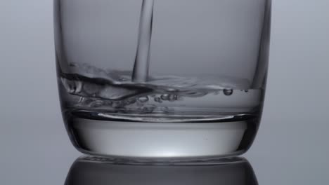 water pouring into a glass