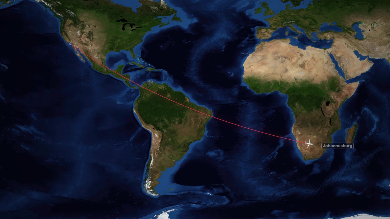 A red line tracks an airplane icon flying across the Atlantic Ocean on world map