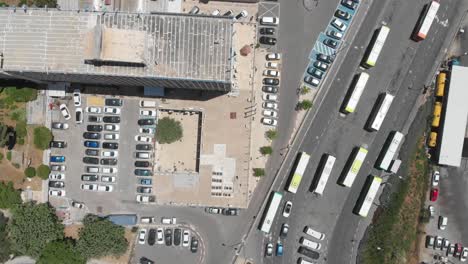 aerial view of city intersection with parking and buses