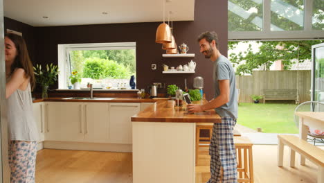 Young-man-working-from-home-talking-to