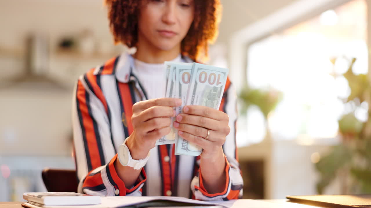 Woman Holding One Hundred Dollar Bills