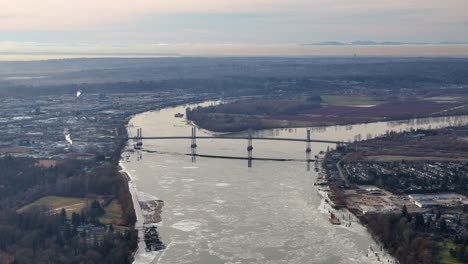 Aerial-Landscape-View-of-Icy-Fraser-River-and-Golden-Ears-Bridge-in-BC