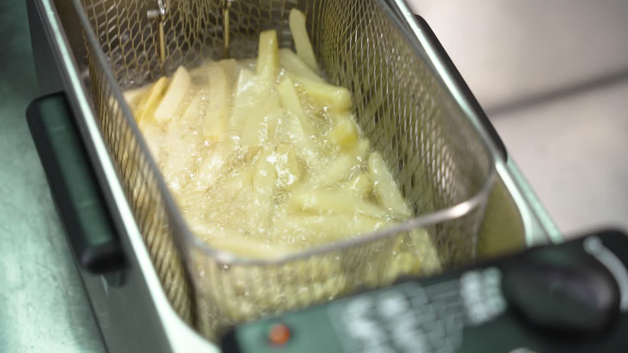 Food being fried in a deep fryer