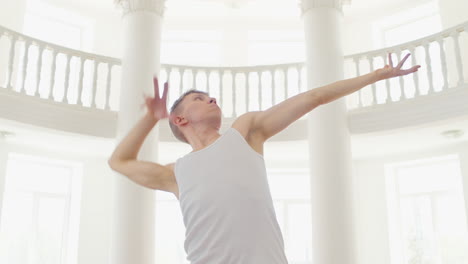 focused young man in casual wear performing a contemporary dance in the studio 2 1