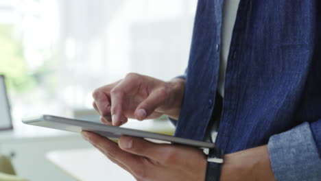 closeup hands of creative browsing tablet