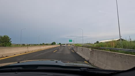 car journey through highway with road signs