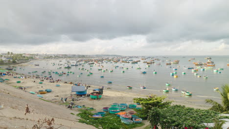 Long-shot-of-round-fishing-boats-docked-in-calm-waters-of-Mui-Ne-beach