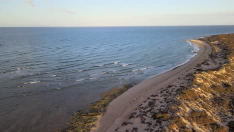 Drone-aerial-over-the-Ningaloo-reef-coastline-beaches-during-sunset