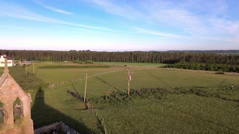 st peters church bell tower aerial view establishing rural welsh newborough forest at sunrise