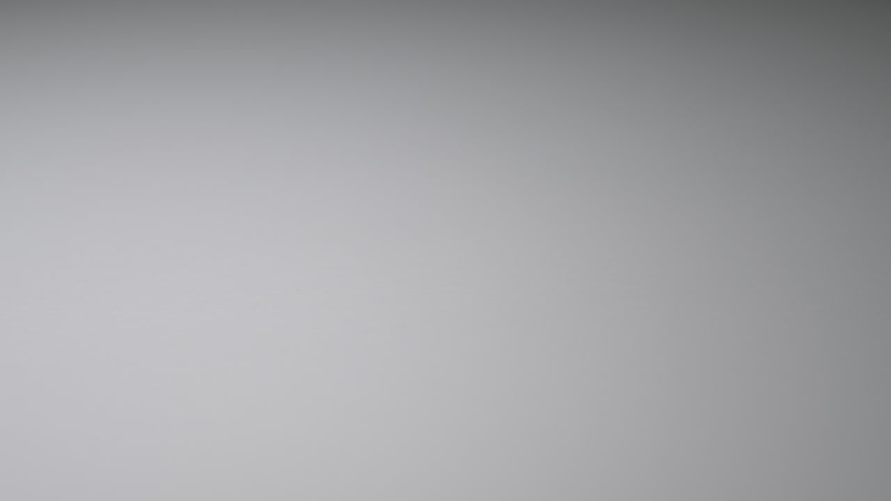 Panning to show single capsule full of ground medicinal cannabis.