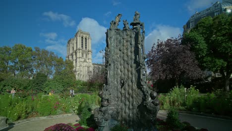 square rene viviani and the notre dame cathedral in the background, paris, france