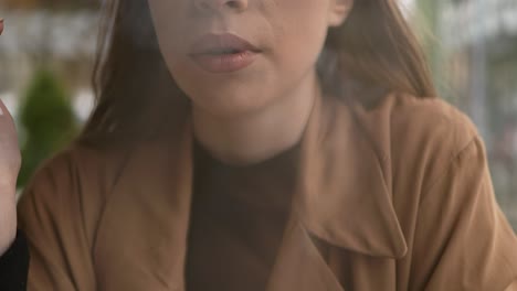 close-up girl face smoking cigarette. unhealthy habit destroying health.
