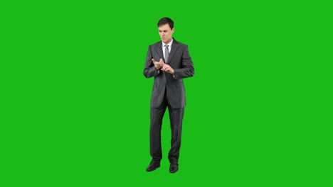 man in suit gesturing and explaining on green screen