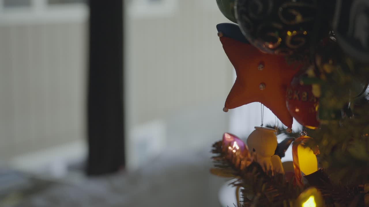 Pedestal up over Holiday ornaments from over the years
