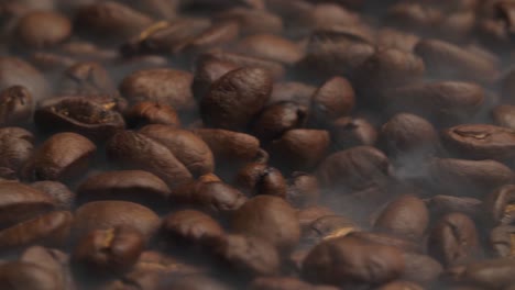 coffee beans fresh roast rotating with smoke, video in 4k, 50fps