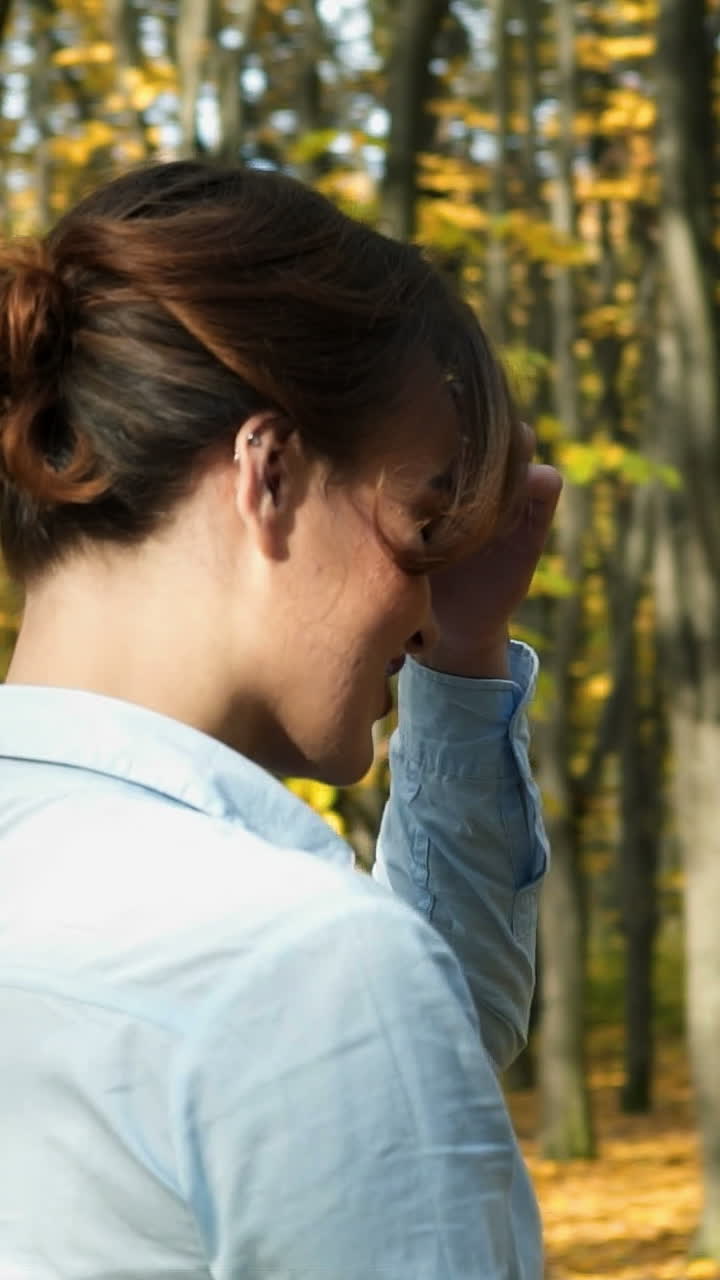 Woman in autumn park. Outdoors portrait of beautiful young woman in autumn park