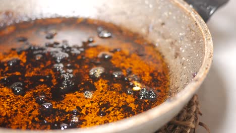 dirty cooking pan with burnt oil