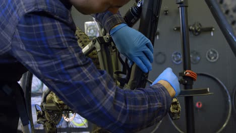 man repairing bicycle in workshop 4k