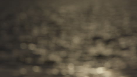 blurred view of shimmering light across rippled water surface for natural background