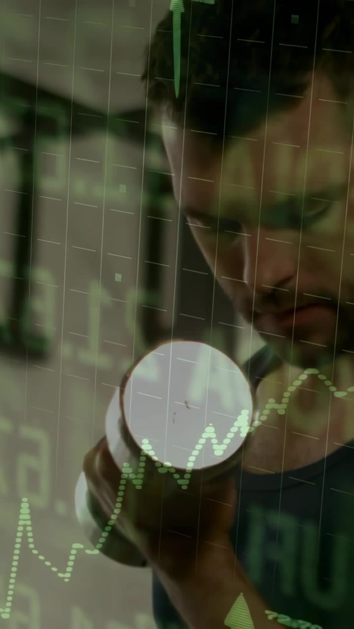 Vertical video: Man gripping dumbbell, bicep curling in gym with green graph tracking progress