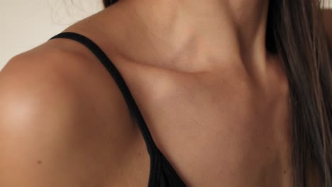 Close-up-of-collarbone-of-unrecognizable-woman-in-underwear.