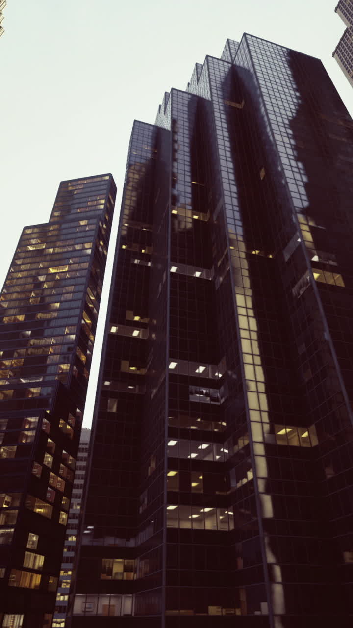 City skyscrapers rise against dusk sky in urban landscape