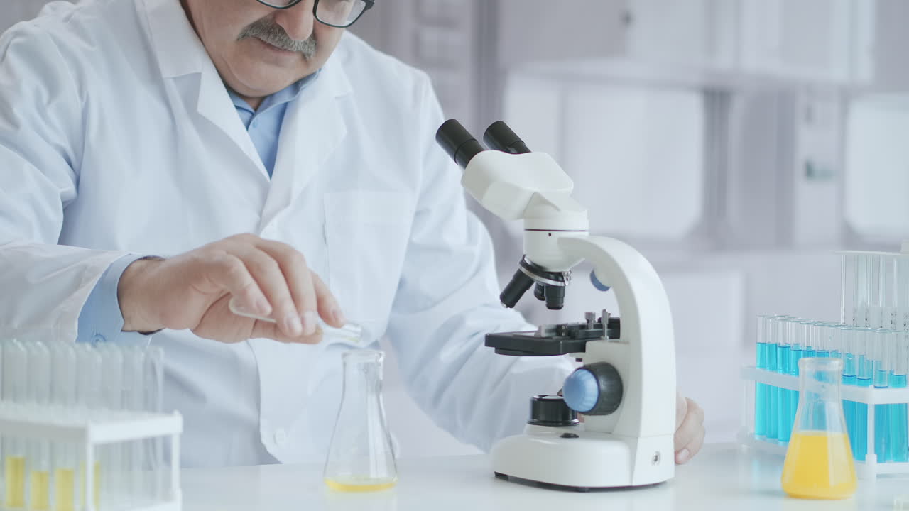 Scientists test for Covid-19 or Corona virus By using science tubes to research and treat illness in a lab or hospital. Medical treatment concepts. High quality 4k footage