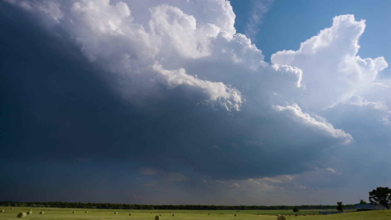 Storm Clouds Over a Hay Field