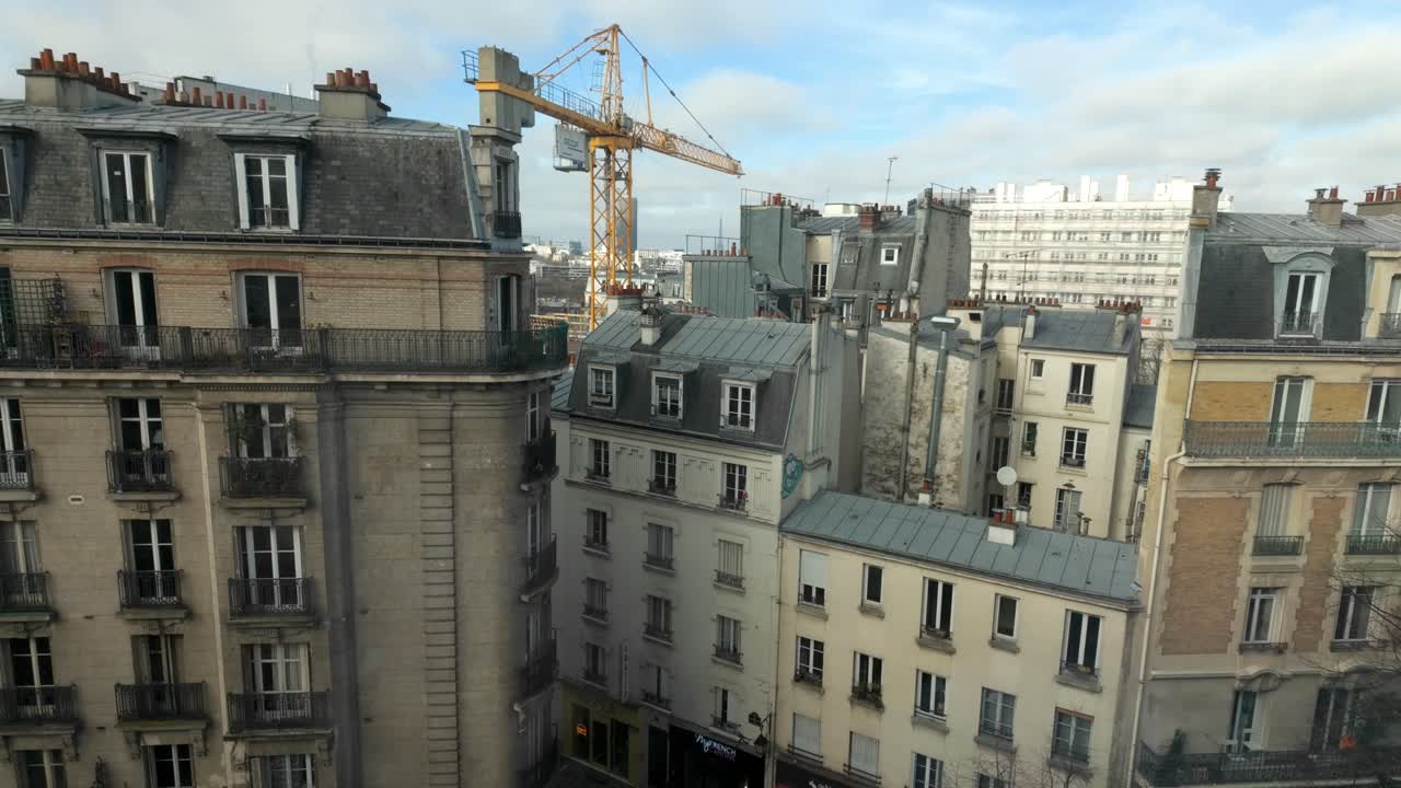 Paris construction crane, rooftops and buildings 4K 24FPS