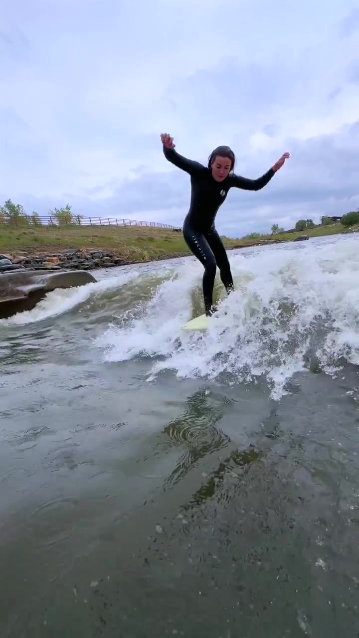 Female surfer drop in off bank River carve surfing made made glassy Benihanas Wave surfing Denver South Platte River Englewood Sheridan Front Range Chatfield reservoir state park run off snow melt