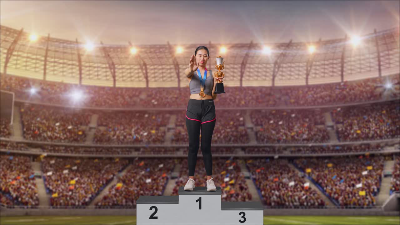 Full Body Of Asian Woman With A Gold Medal And Trophy Disapproving With No Hand Sign And Smiling To Camera At The Stadium