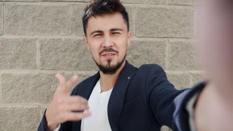 man taking a selfie outside