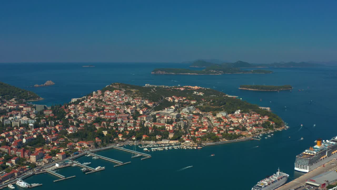 Descending aerial shot of Dubrovnik cruise ship terminal and parked ships, Croatia