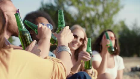 young people drinking beer on the beach/dabrowa gornicza/poland