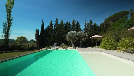 slow rising shot overhead a private pool in the garden of a villa in nimes