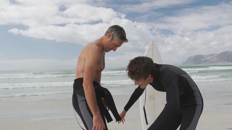 Father and young adult son enjoying outdoor activities together
