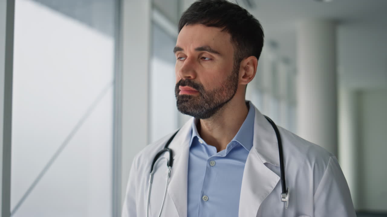 Sad doctor talking smartphone closeup. Upset man informing about disease death