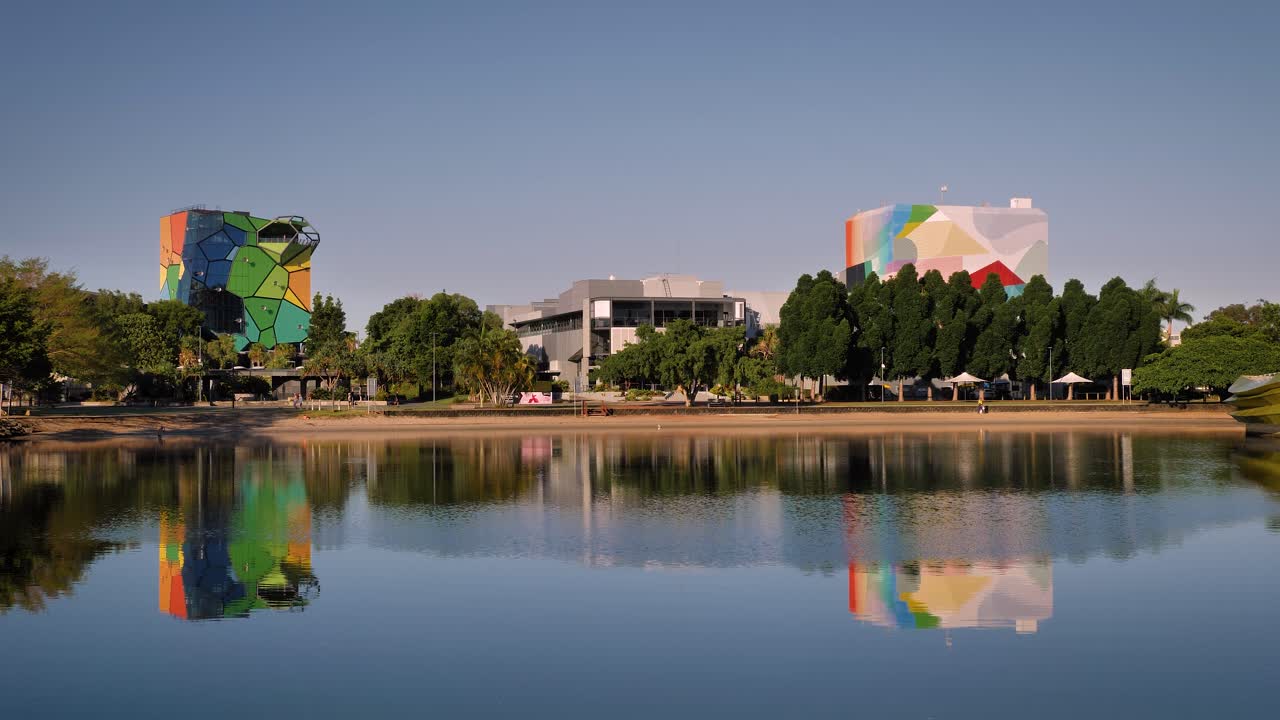 View of HOTA across the Home of the Arts Lake on a sunny day, Gold Coast, Queensland, Australia