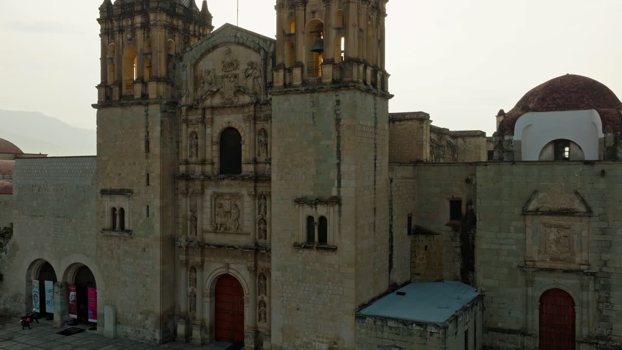 DRONE: CRANE SHOT OF SANTO DOMINGO CHAPEL IN DOWNTOWN OAXACA AT SUNRISE