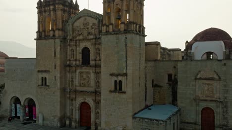 drone: crane shot of santo domingo chapel in downtown oaxaca at sunrise