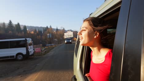 woman enjoying a scenic drive through the mountains