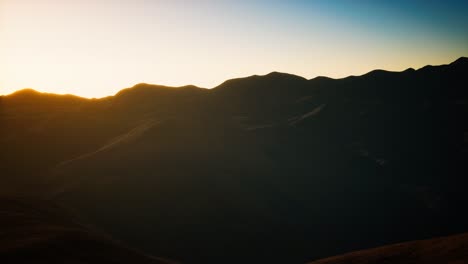 hills-with-rocks-at-sunset