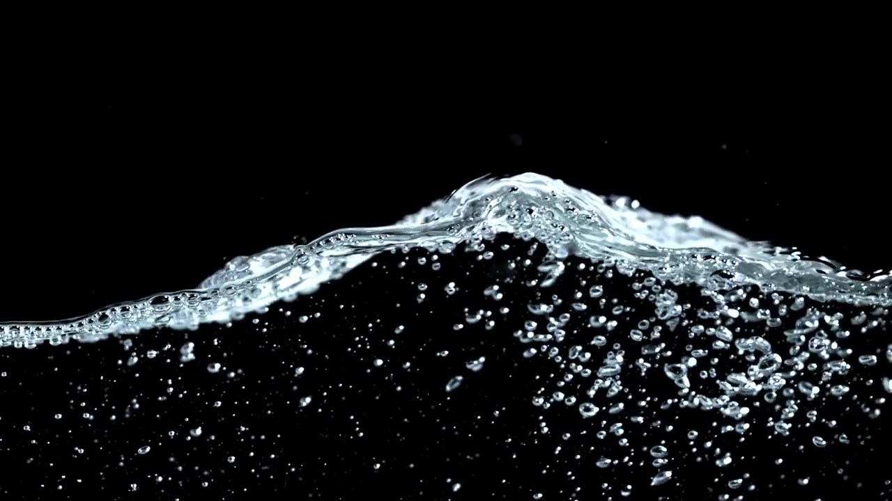 Slow Motion Clear Water Surface with Bubbles and Splashing Drops