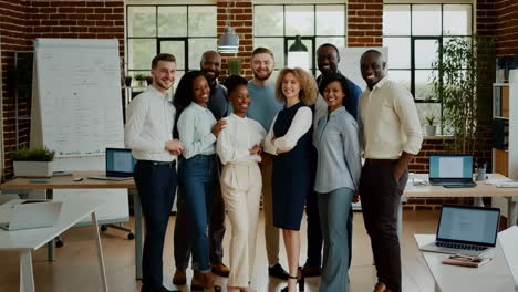 diverse group of business professionals posing in modern office
