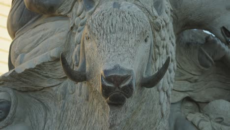 stone carving of a wild ram