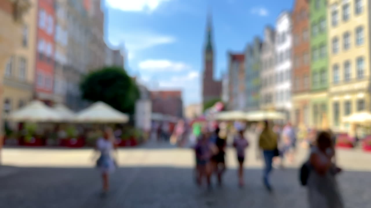 Blurred Images Of Tourists And Locals Walking Through The Colorful Streets Of Ulica Dluga In Gdansk Old Town In Poland - slow motion shot