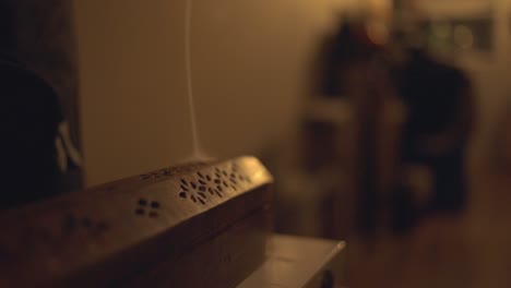 relaxing mood with burning incense inside a vintage metal case